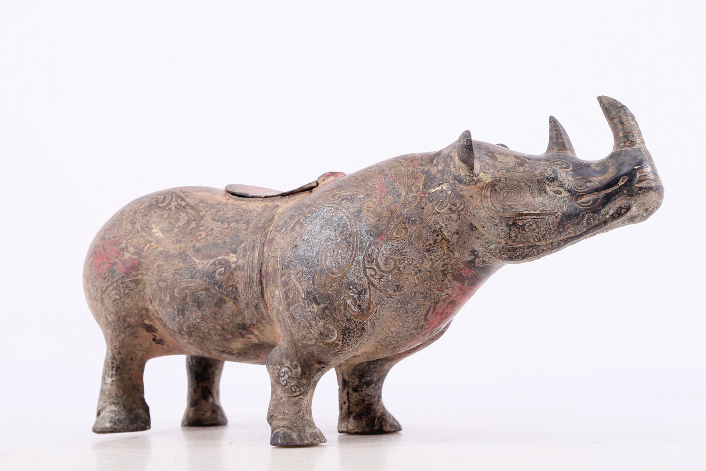 An exquisite bronze-inlaid silver rhinoceros ornament