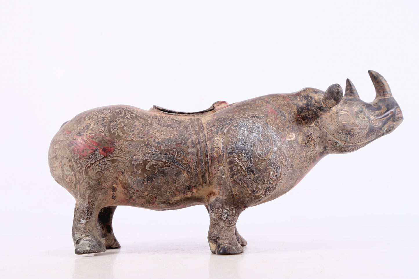 An exquisite bronze-inlaid silver rhinoceros ornament