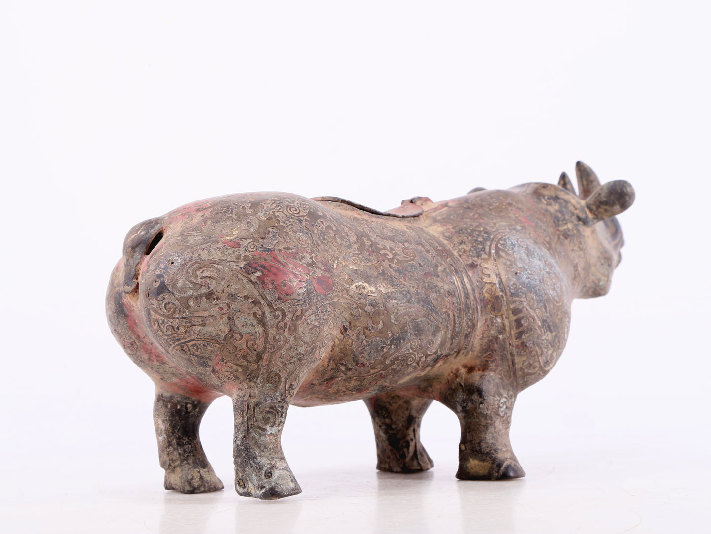 An exquisite bronze-inlaid silver rhinoceros ornament