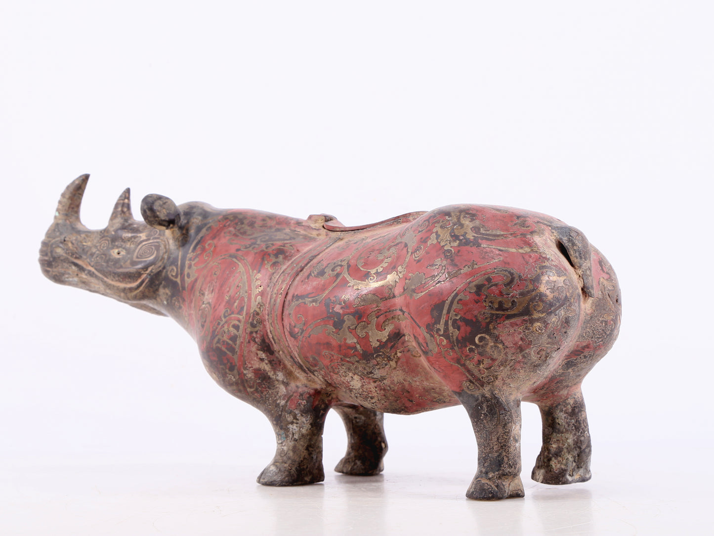 An exquisite bronze-inlaid silver rhinoceros ornament