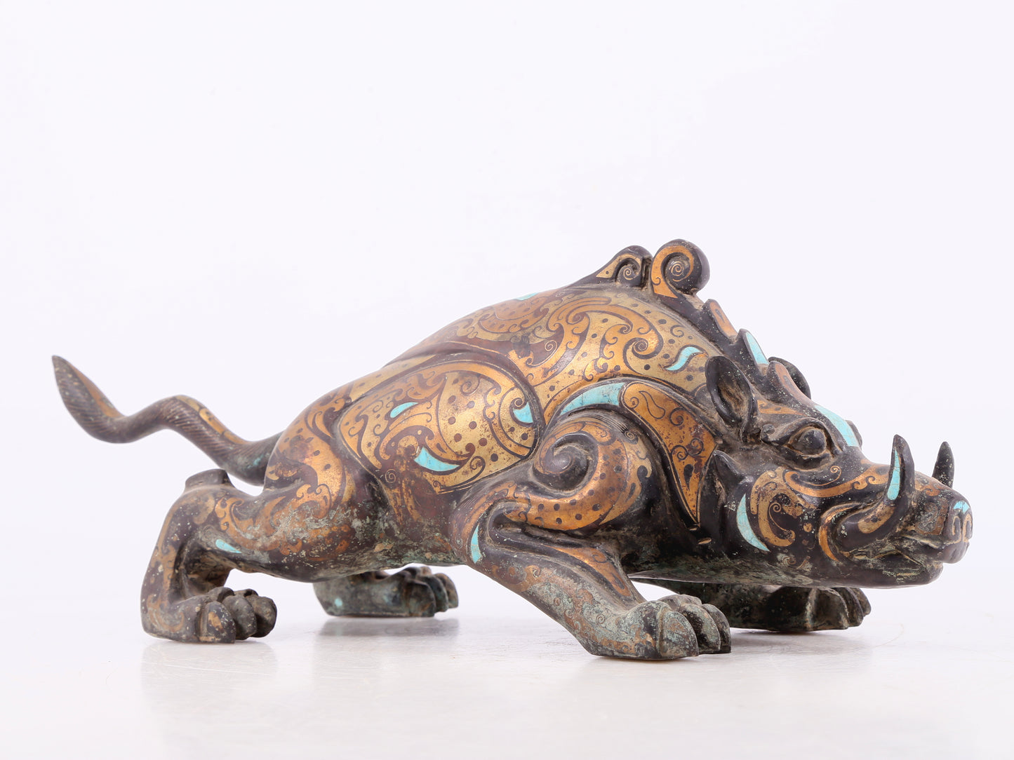 An exquisite bronze inlaid with gold and turquoise auspicious animal ornaments