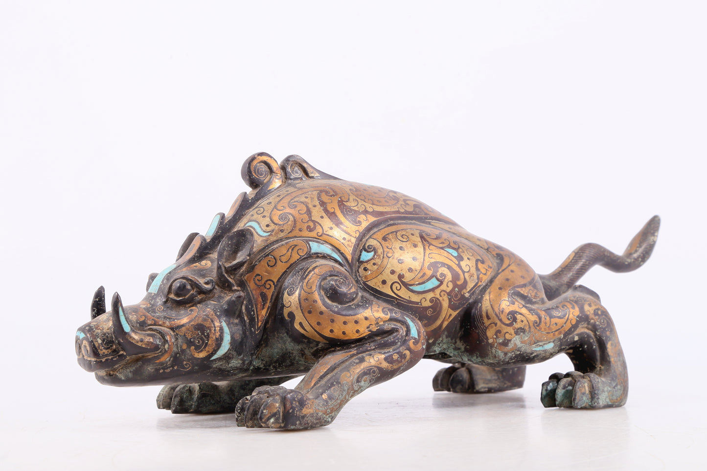 An exquisite bronze inlaid with gold and turquoise auspicious animal ornaments