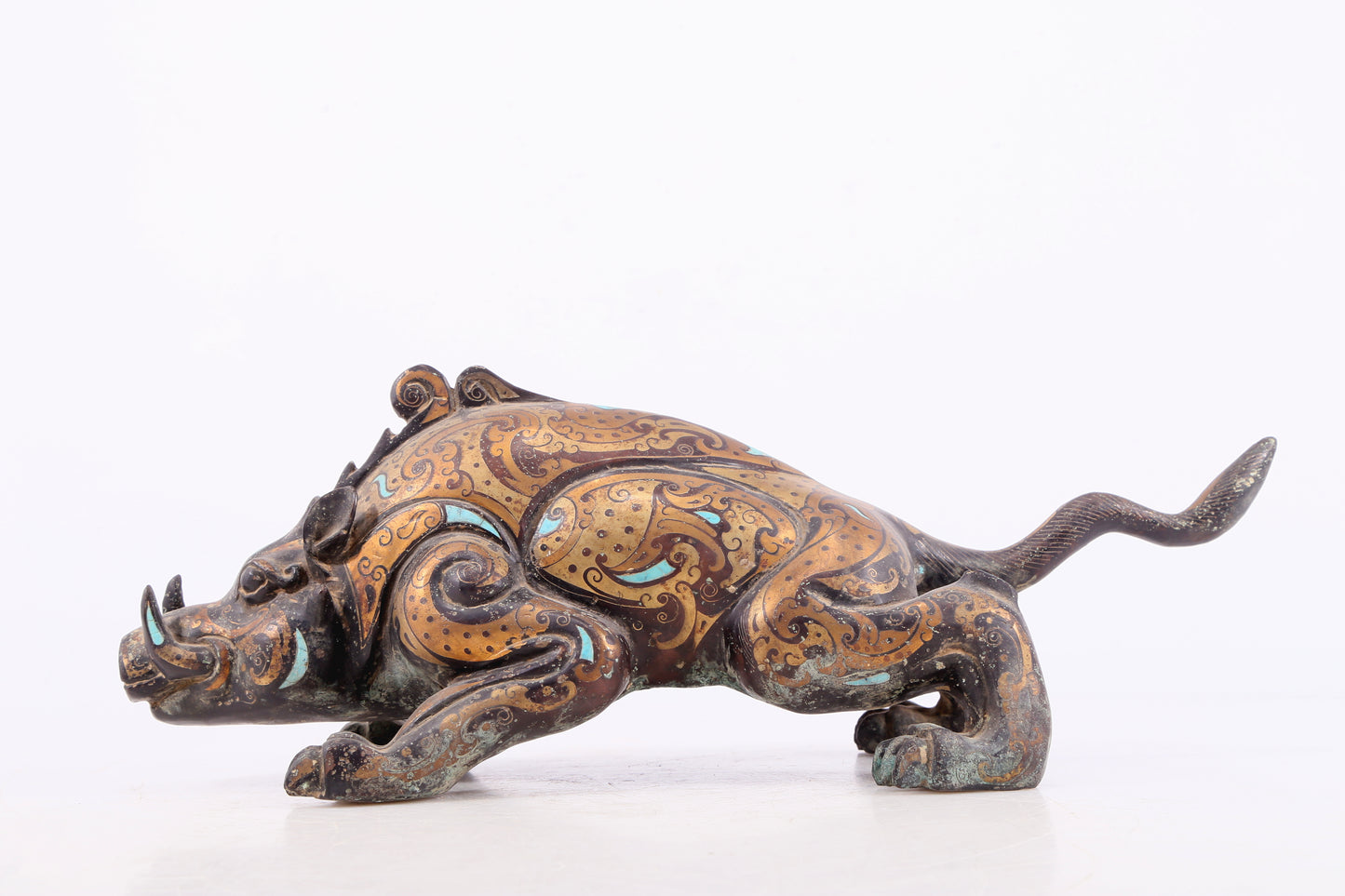 An exquisite bronze inlaid with gold and turquoise auspicious animal ornaments