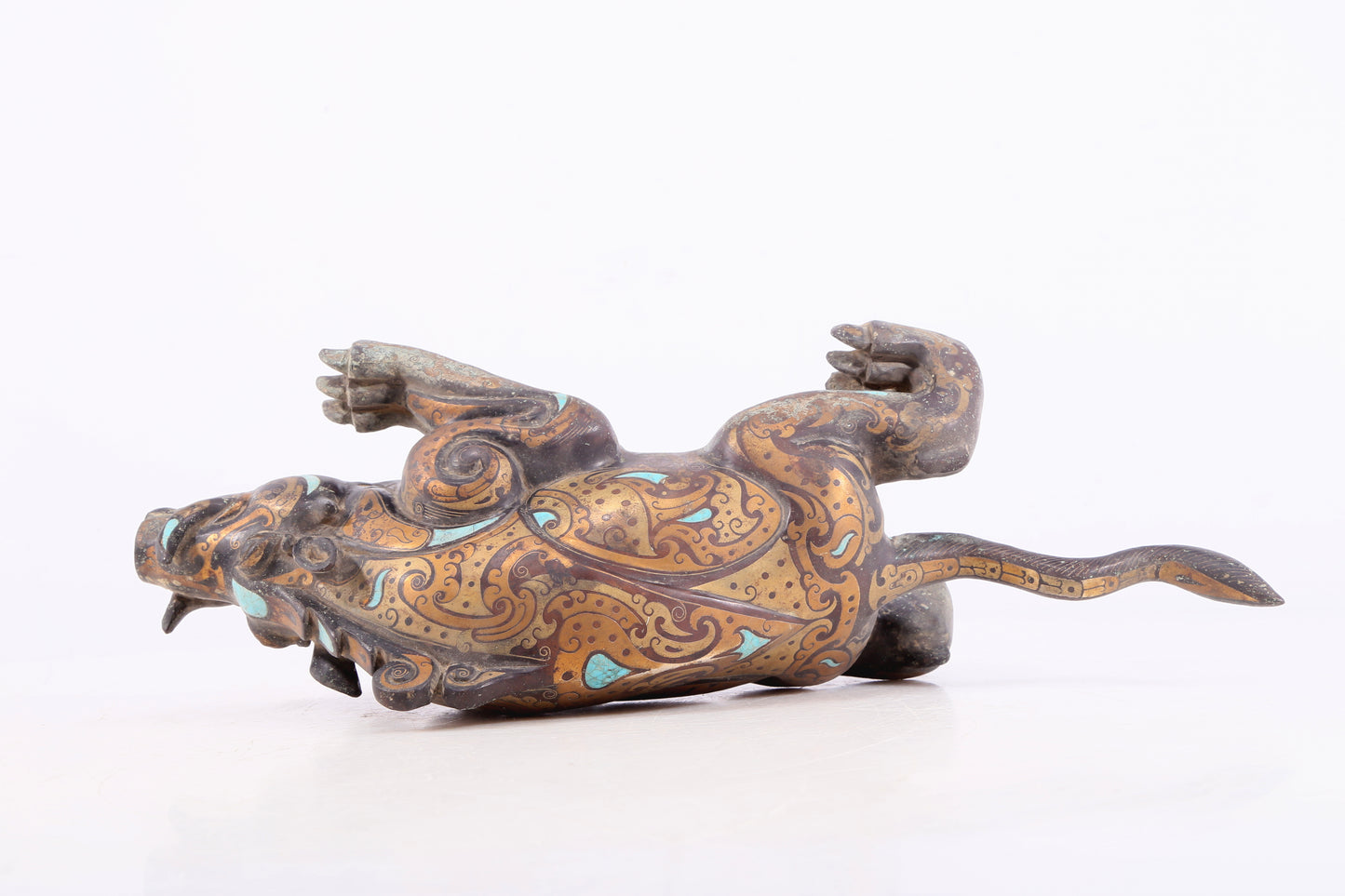 An exquisite bronze inlaid with gold and turquoise auspicious animal ornaments