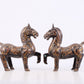 A pair of bronze inlaid gold and silver horse ornaments