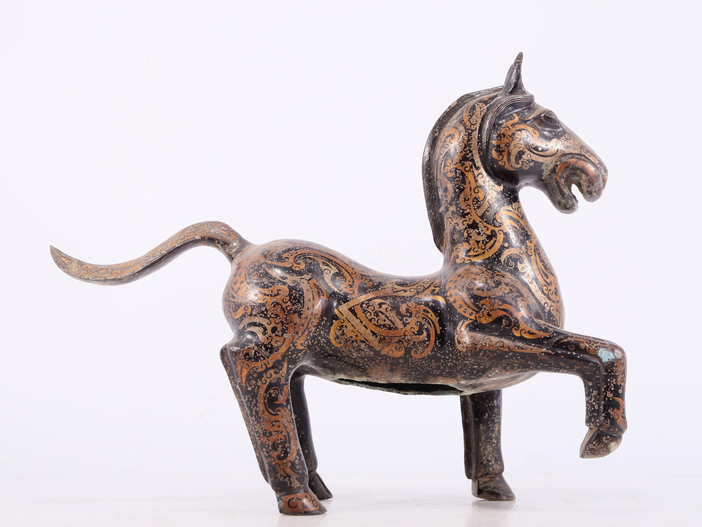 A pair of bronze inlaid gold and silver horse ornaments