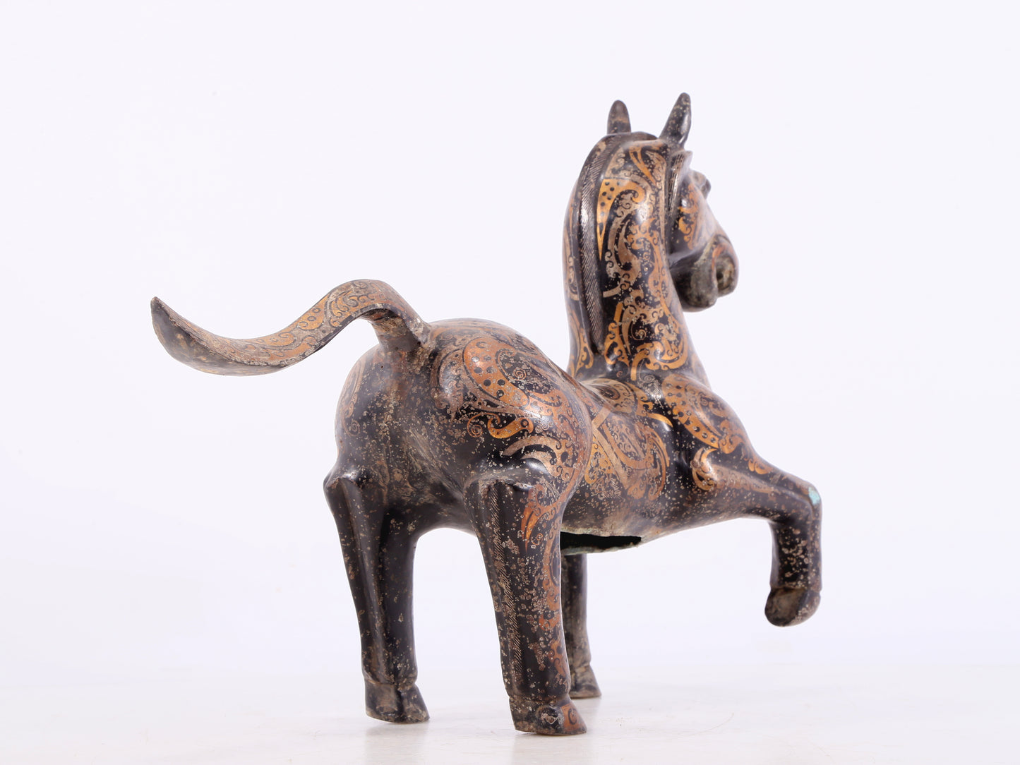 A pair of bronze inlaid gold and silver horse ornaments