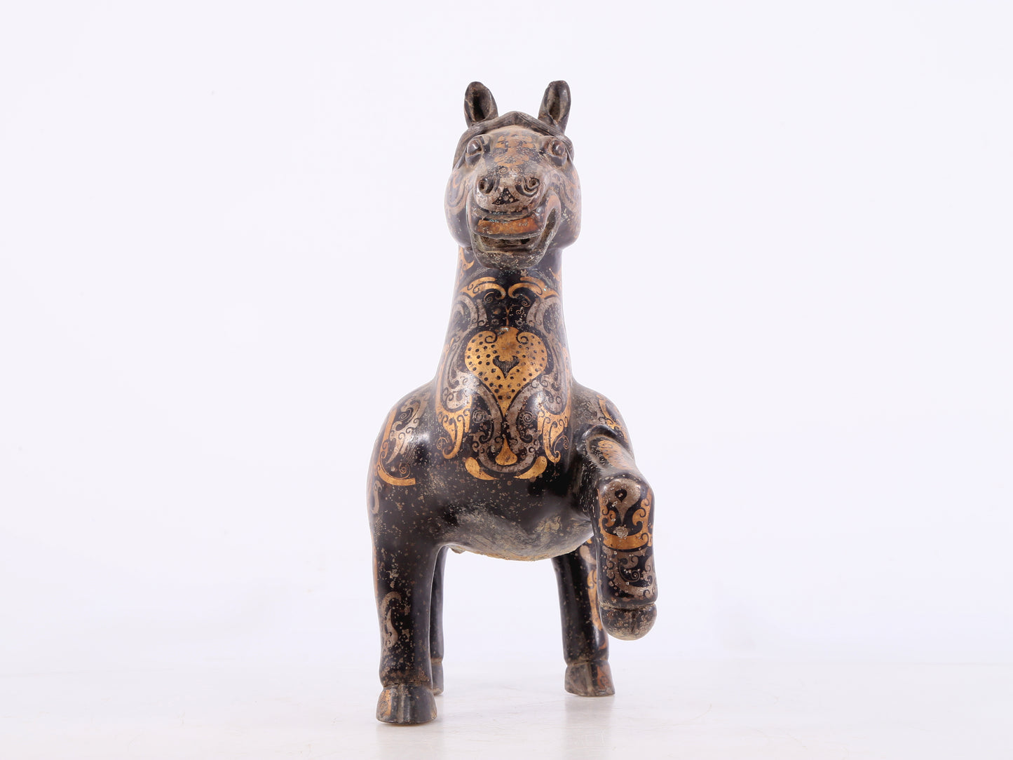 A pair of bronze inlaid gold and silver horse ornaments