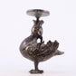 An exquisite bronze inlaid gold and silver candlestick with auspicious animals