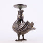 An exquisite bronze inlaid gold and silver candlestick with auspicious animals