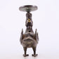 An exquisite bronze inlaid gold and silver candlestick with auspicious animals