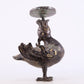 An exquisite bronze inlaid gold and silver candlestick with auspicious animals