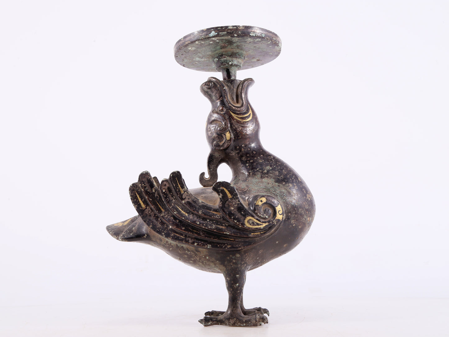 An exquisite bronze inlaid gold and silver candlestick with auspicious animals