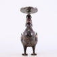 An exquisite bronze inlaid gold and silver candlestick with auspicious animals