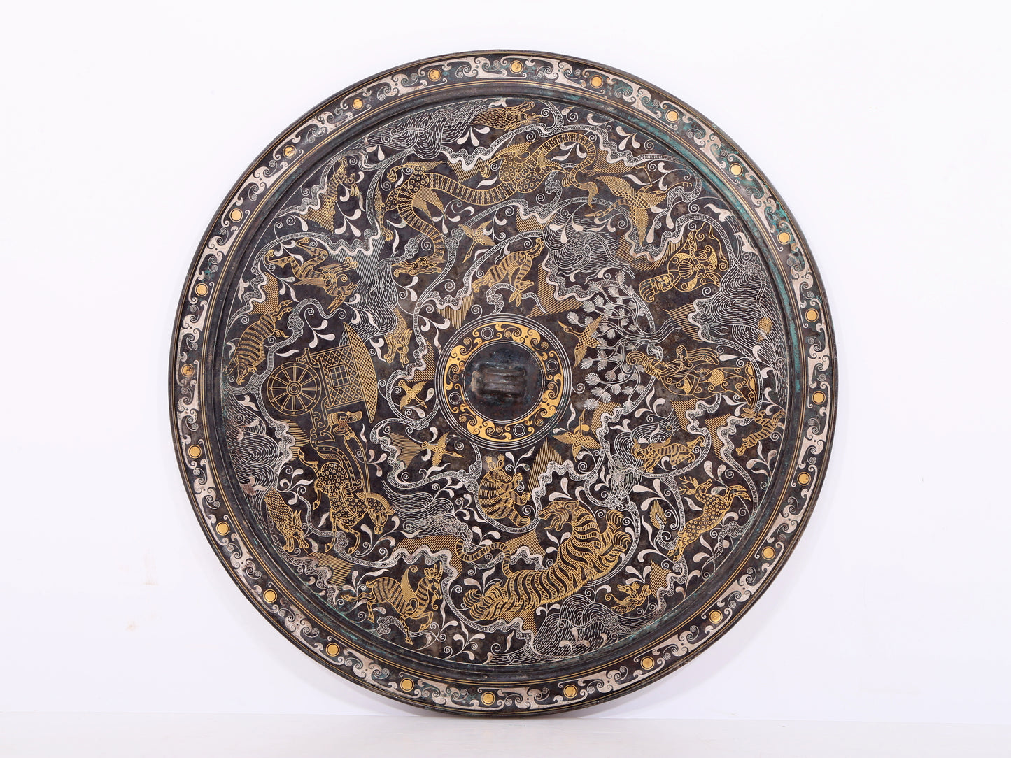 An exquisite bronze inlaid gold and silver mirror with auspicious animal patterns