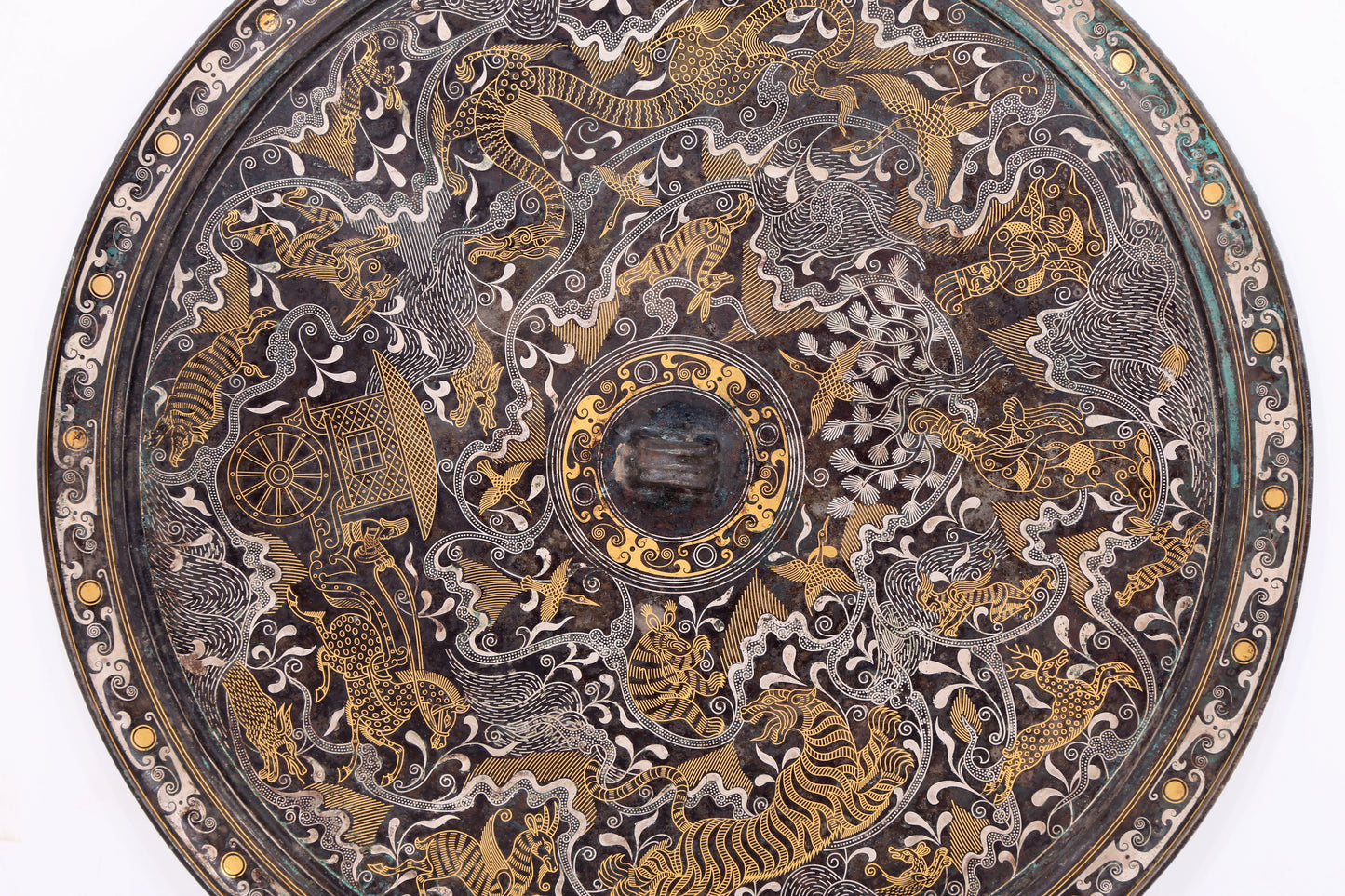 An exquisite bronze inlaid gold and silver mirror with auspicious animal patterns