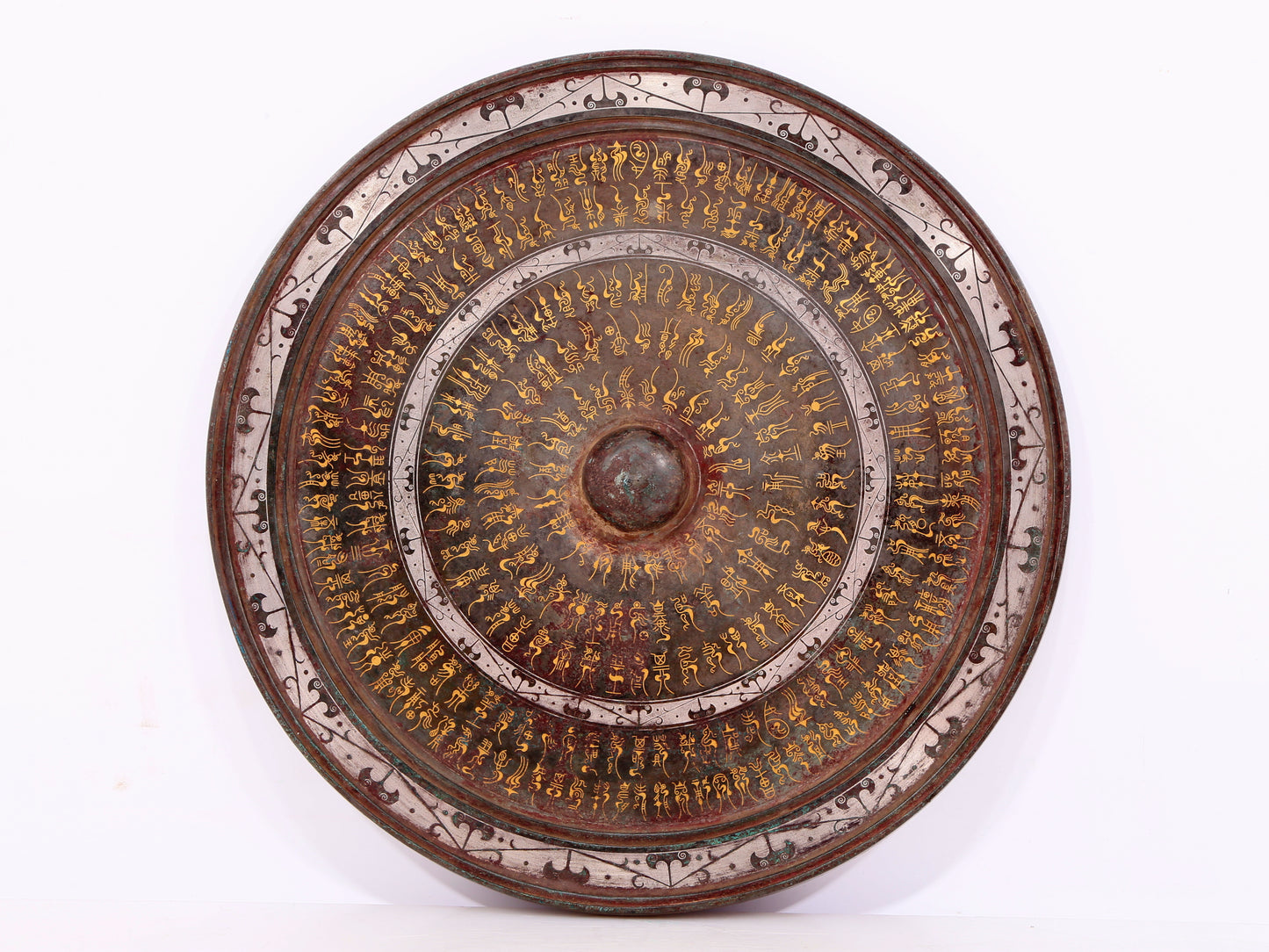 An exquisite bronze inlaid gold and silver round mirror