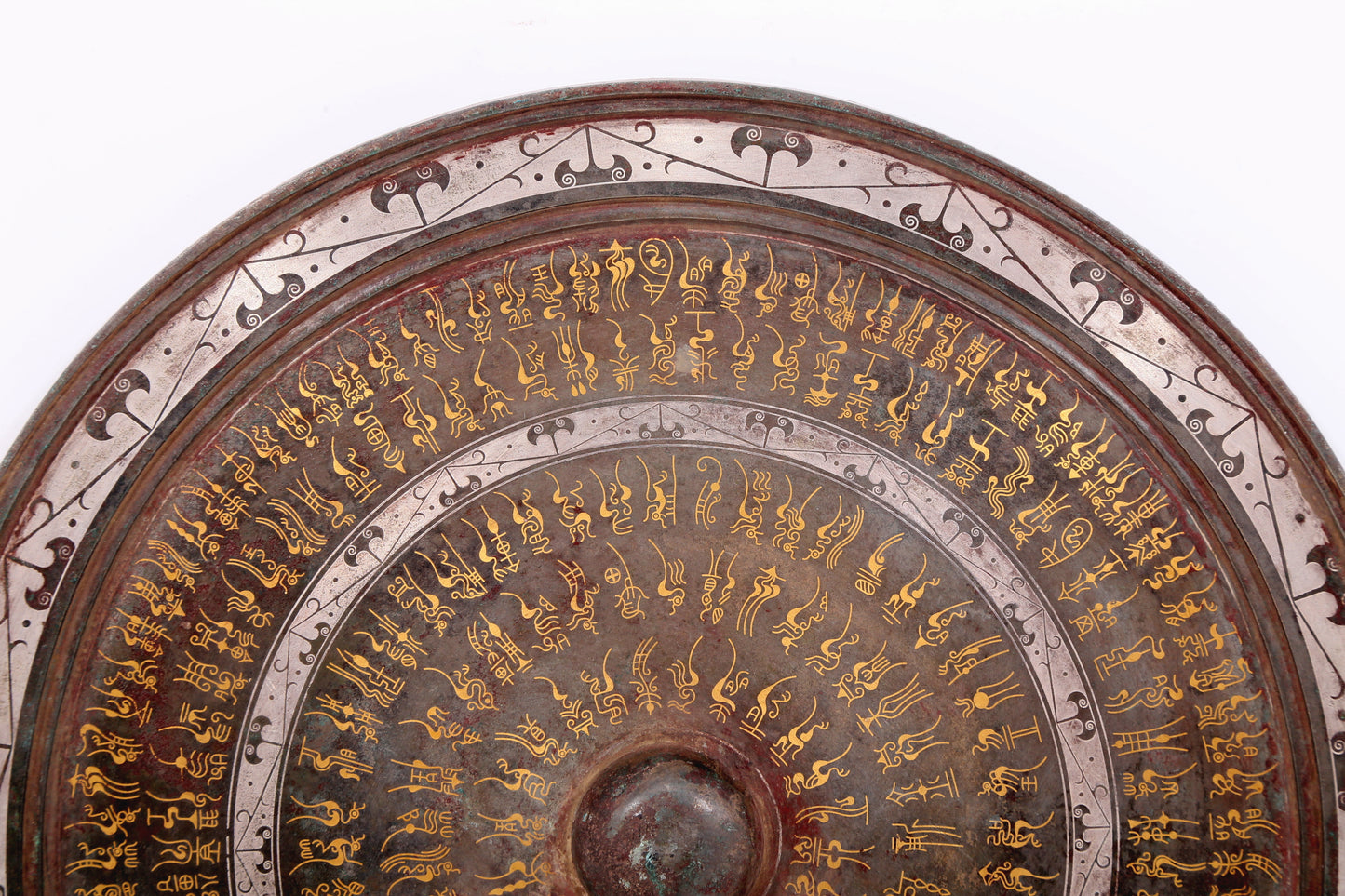 An exquisite bronze inlaid gold and silver round mirror