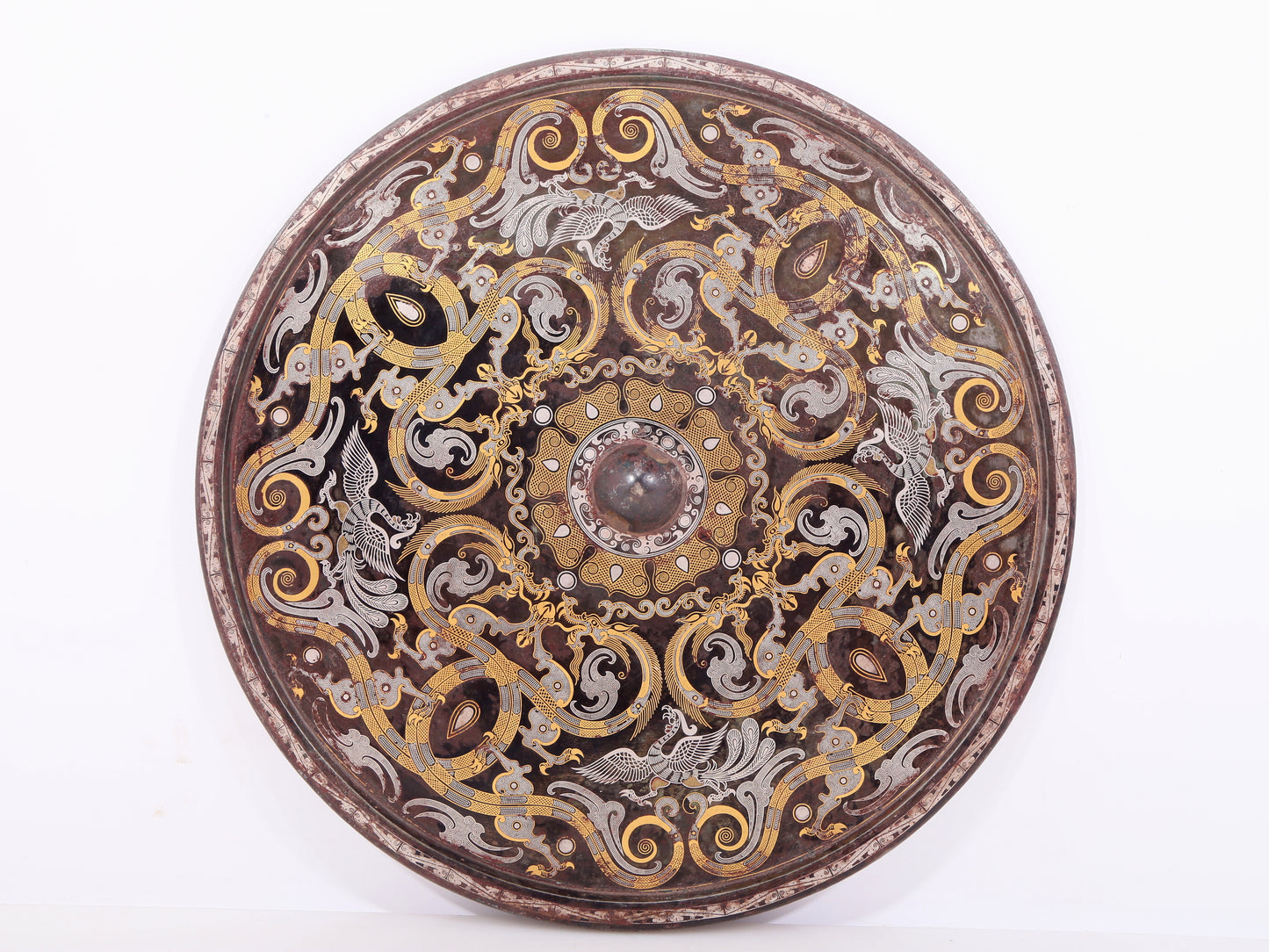 An exquisite bronze inlaid gold and silver dragon and phoenix pattern round mirror