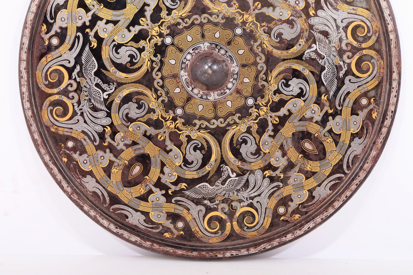 An exquisite bronze inlaid gold and silver dragon and phoenix pattern round mirror