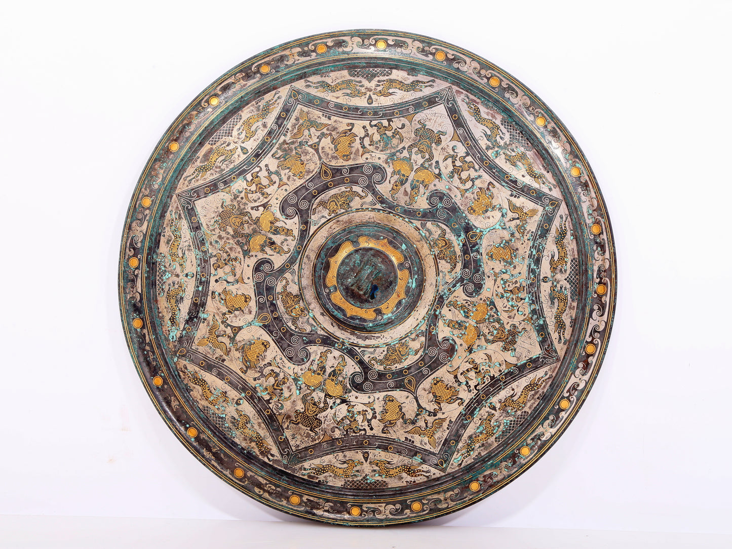 An exquisite bronze inlaid gold and silver round mirror with auspicious animal patterns