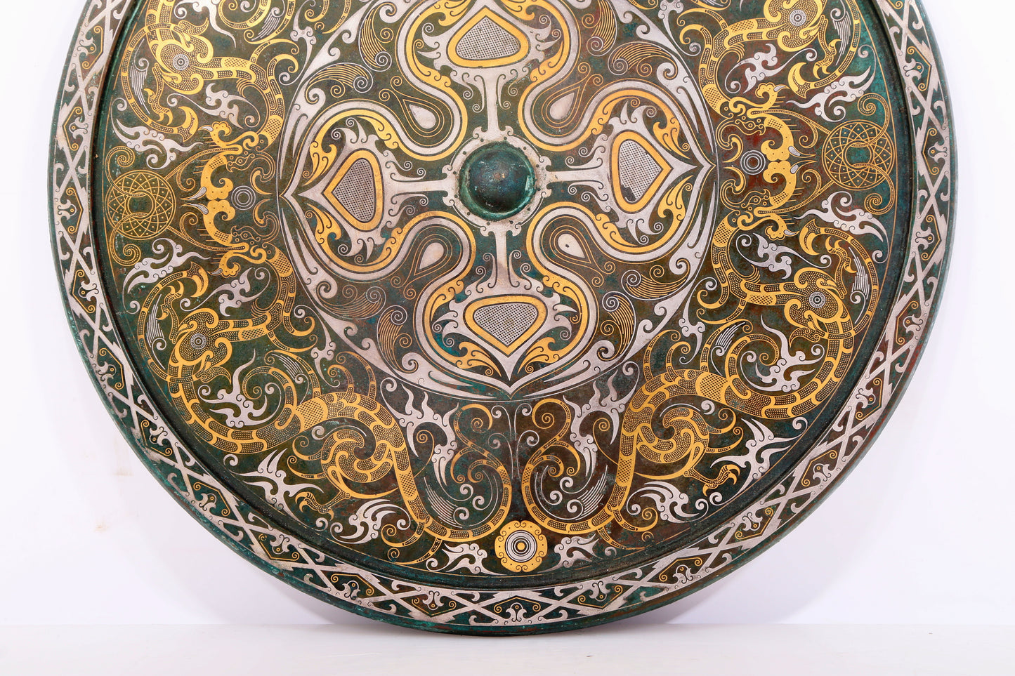 An exquisite bronze inlaid gold and silver round mirror with auspicious clouds and dragon patterns