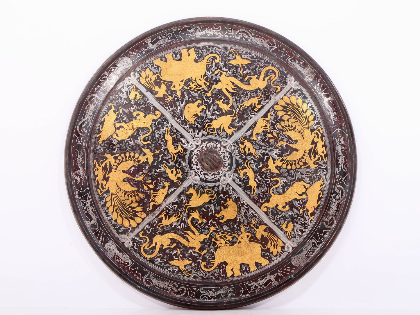 An exquisite bronze inlaid gold and silver round mirror with auspicious animal patterns