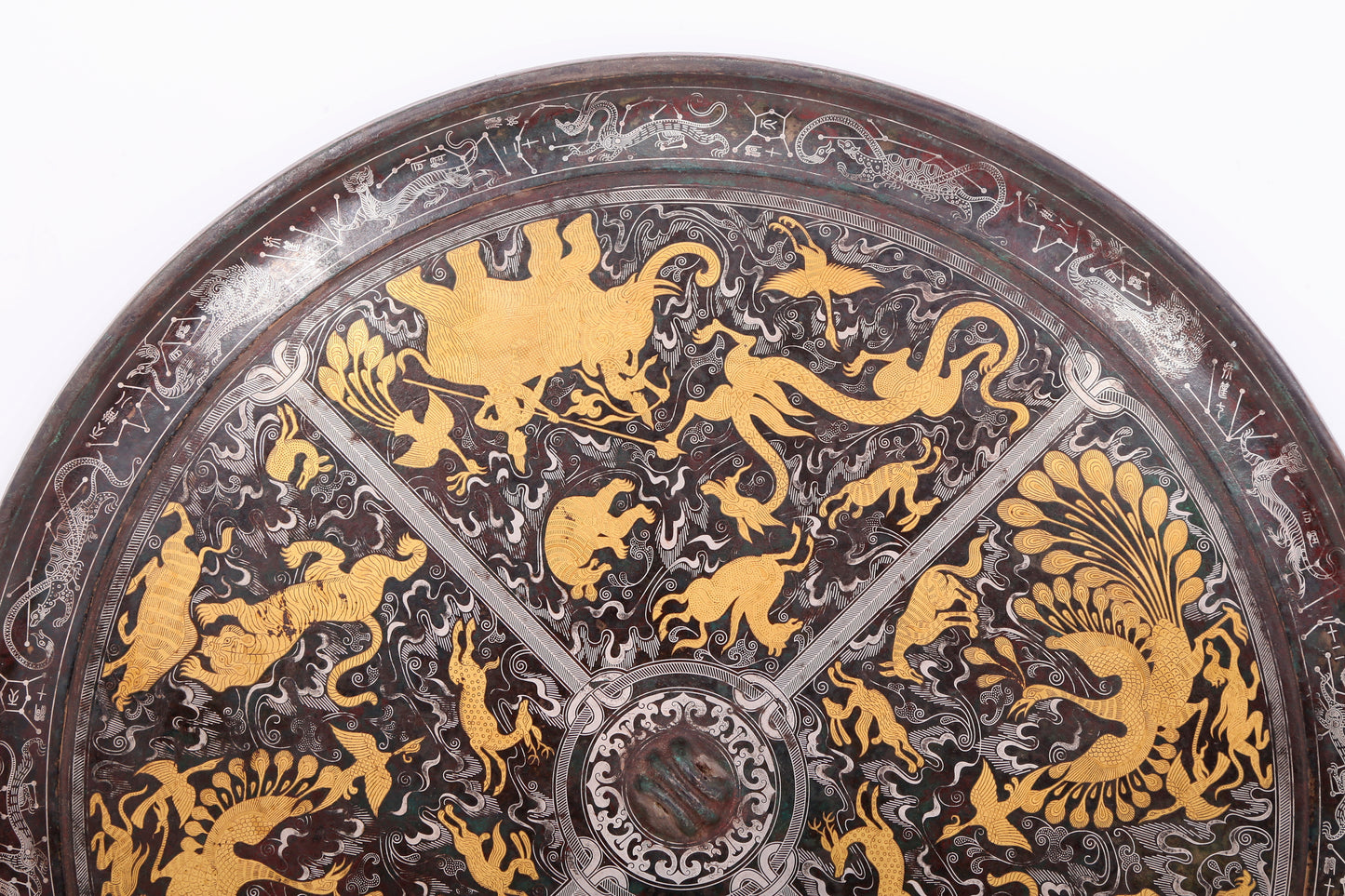 An exquisite bronze inlaid gold and silver round mirror with auspicious animal patterns