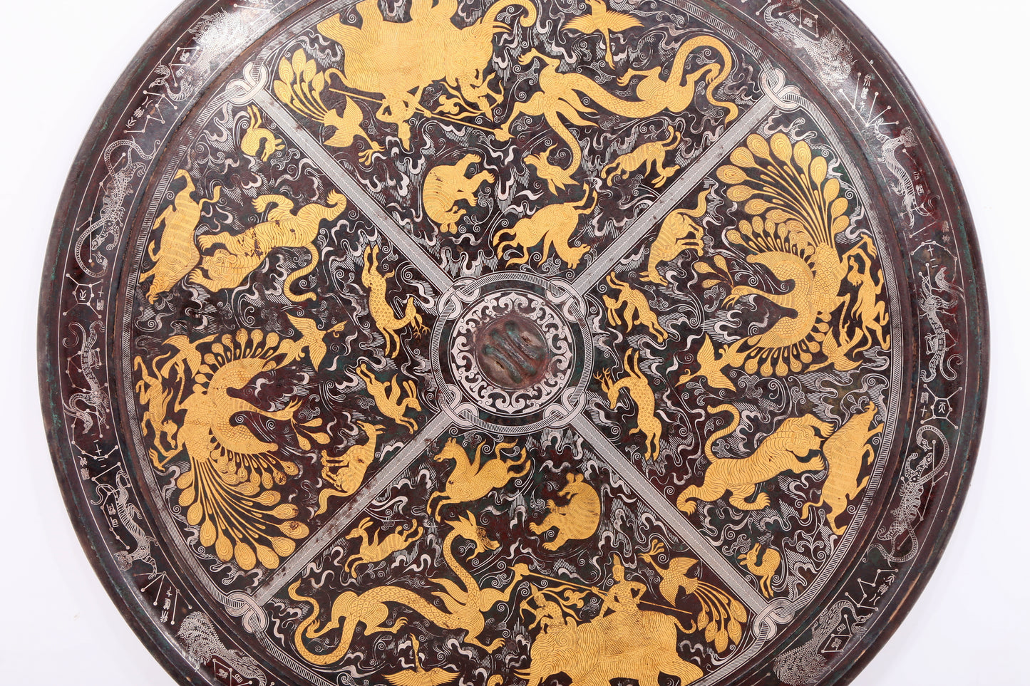 An exquisite bronze inlaid gold and silver round mirror with auspicious animal patterns