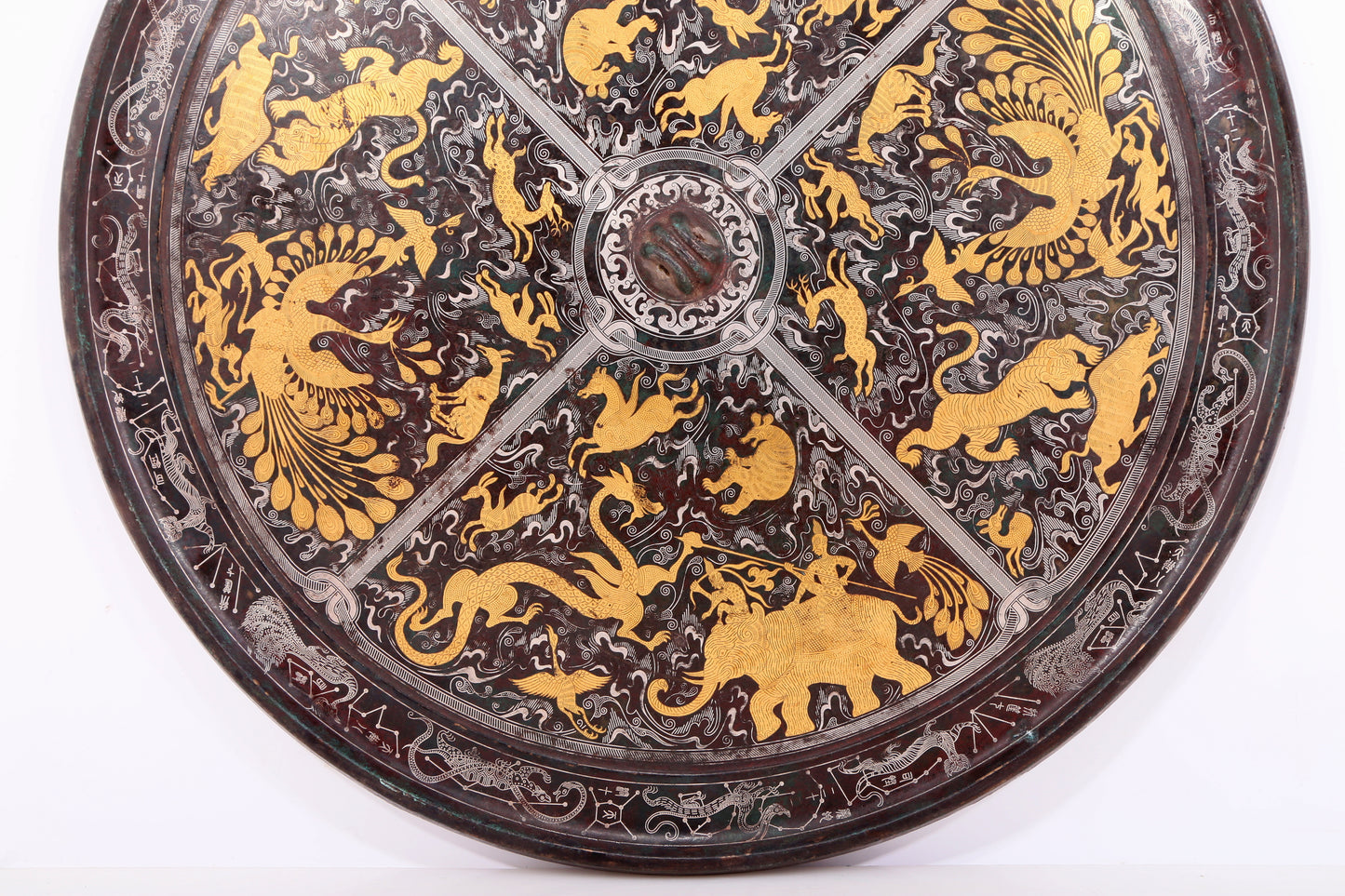 An exquisite bronze inlaid gold and silver round mirror with auspicious animal patterns