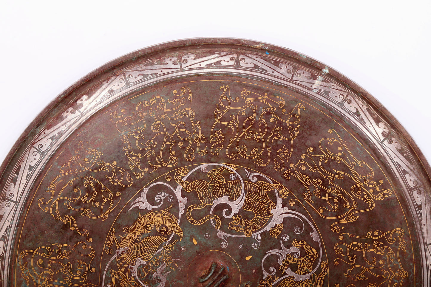 An exquisite bronze inlaid gold and silver round mirror with auspicious animal patterns