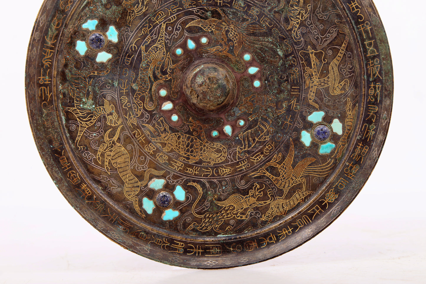 An exquisite bronze inlaid gold and silver round mirror with auspicious animal patterns