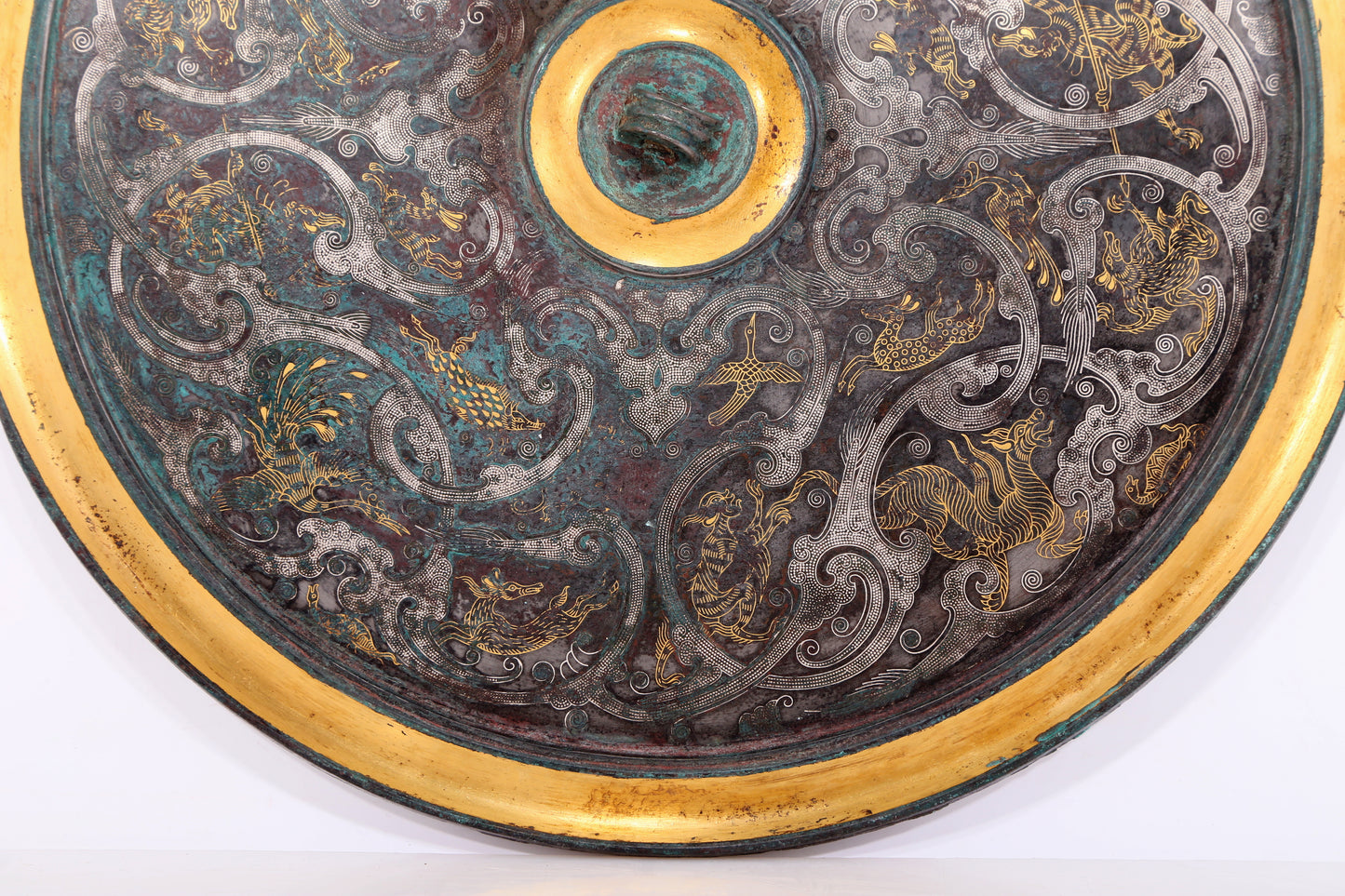 A Magnificent Bronze Gold& Silver-Mounted 'Auspicious Beast' Mirror