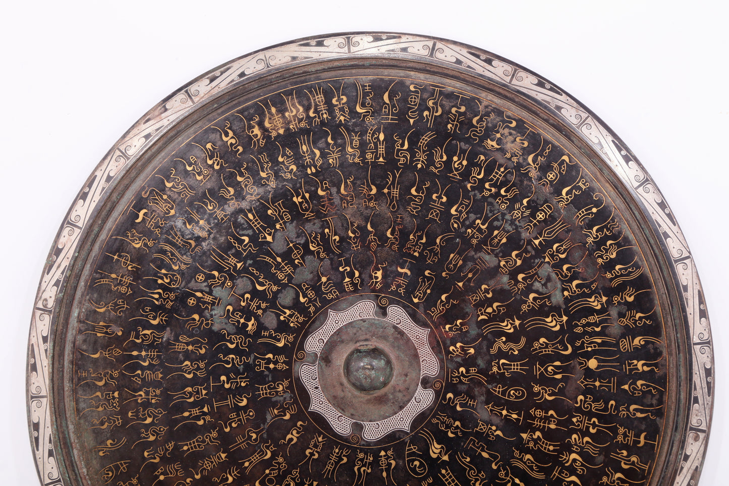 An exquisite bronze inlaid gold and silver Ruyi pattern round mirror