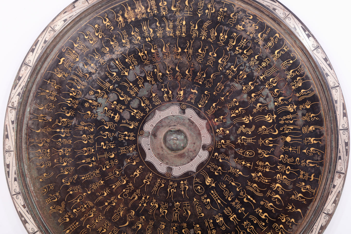 An exquisite bronze inlaid gold and silver Ruyi pattern round mirror