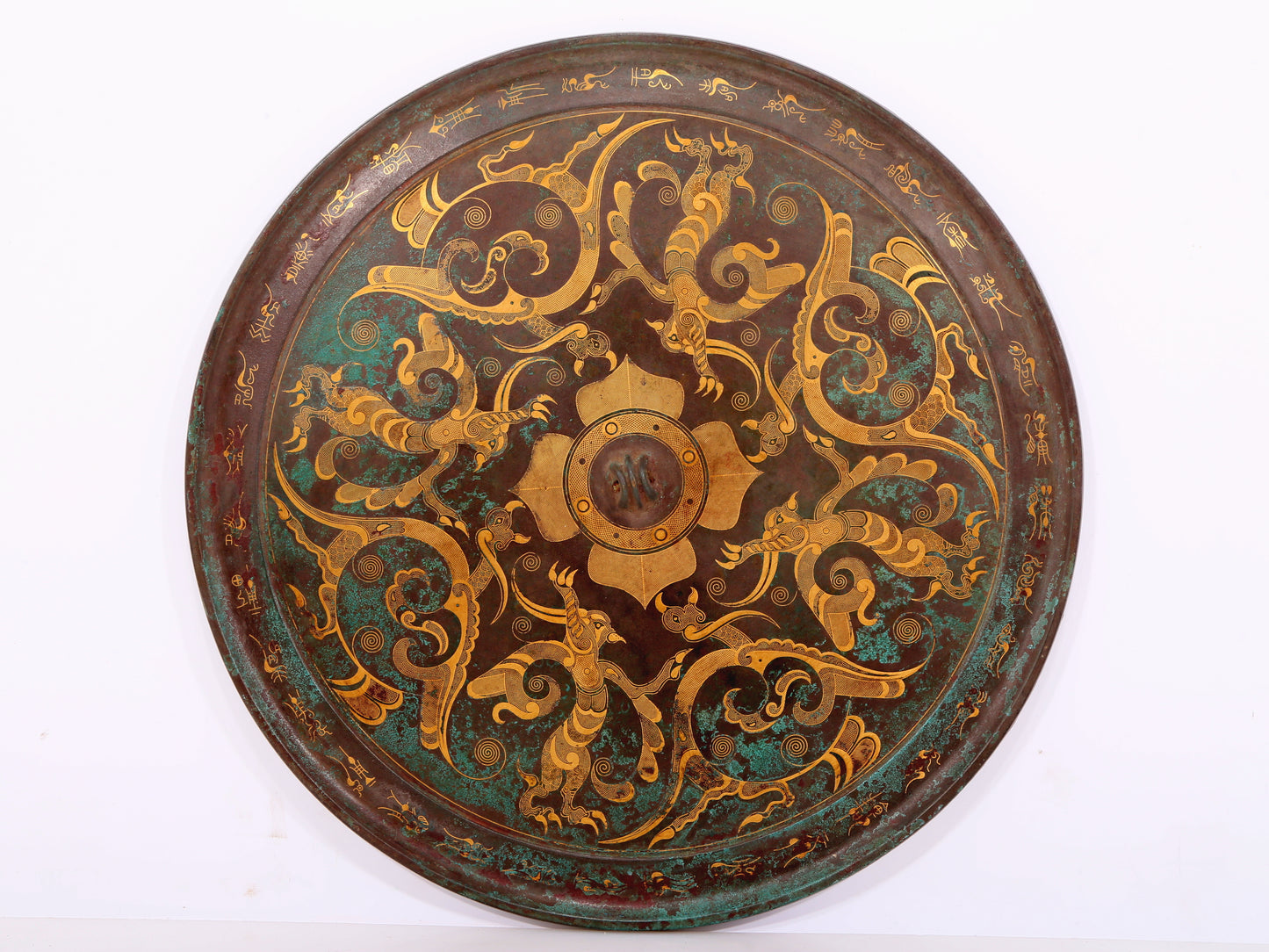 An exquisite bronze inlaid gold and silver round mirror with auspicious animal patterns