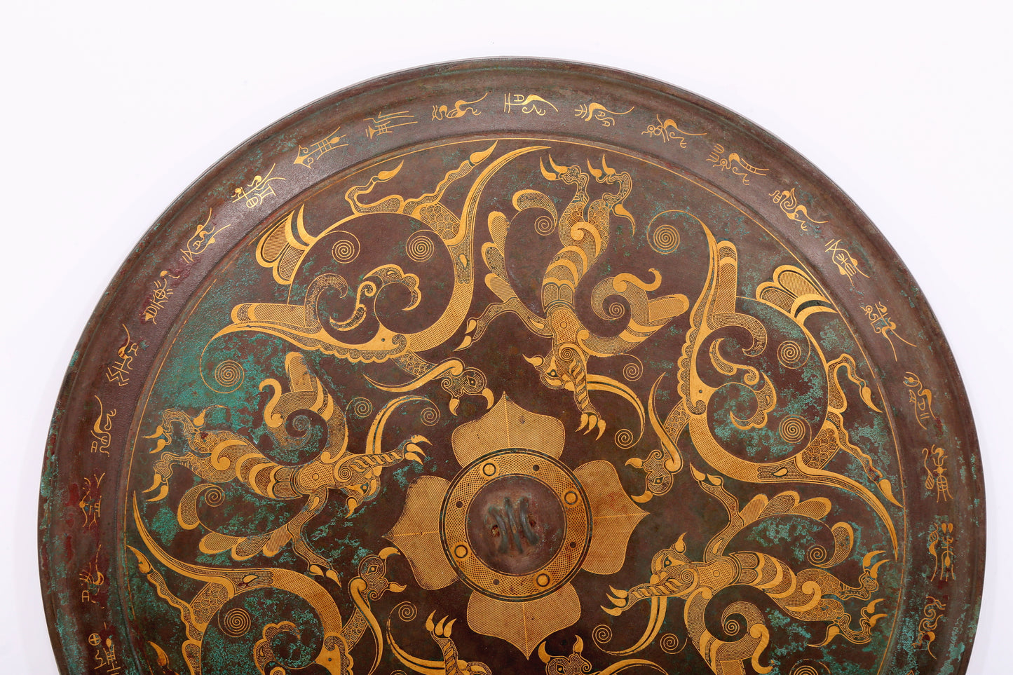 An exquisite bronze inlaid gold and silver round mirror with auspicious animal patterns