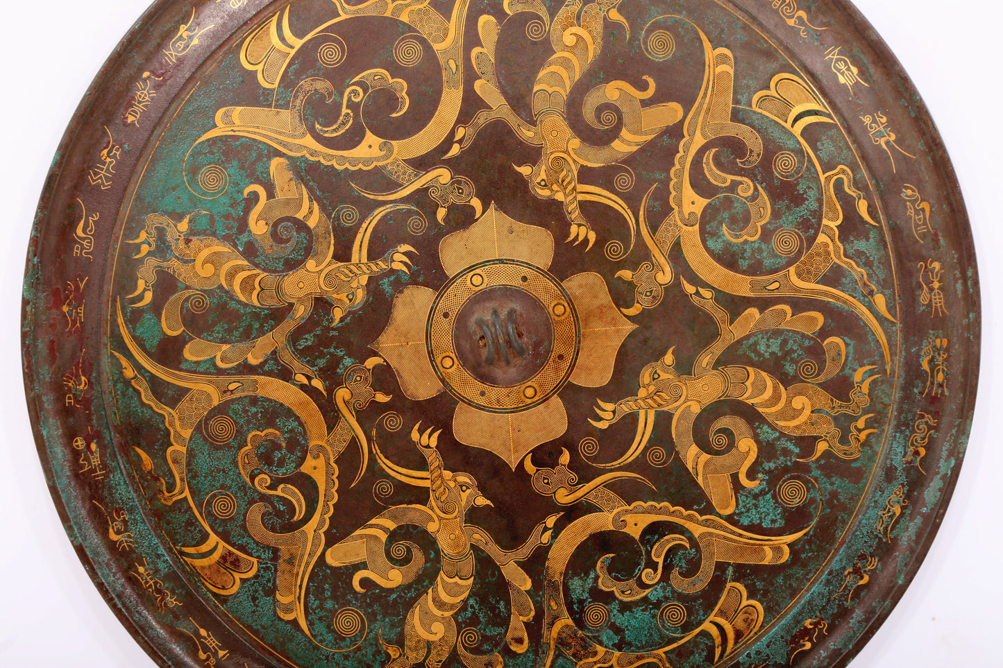 An exquisite bronze inlaid gold and silver round mirror with auspicious animal patterns