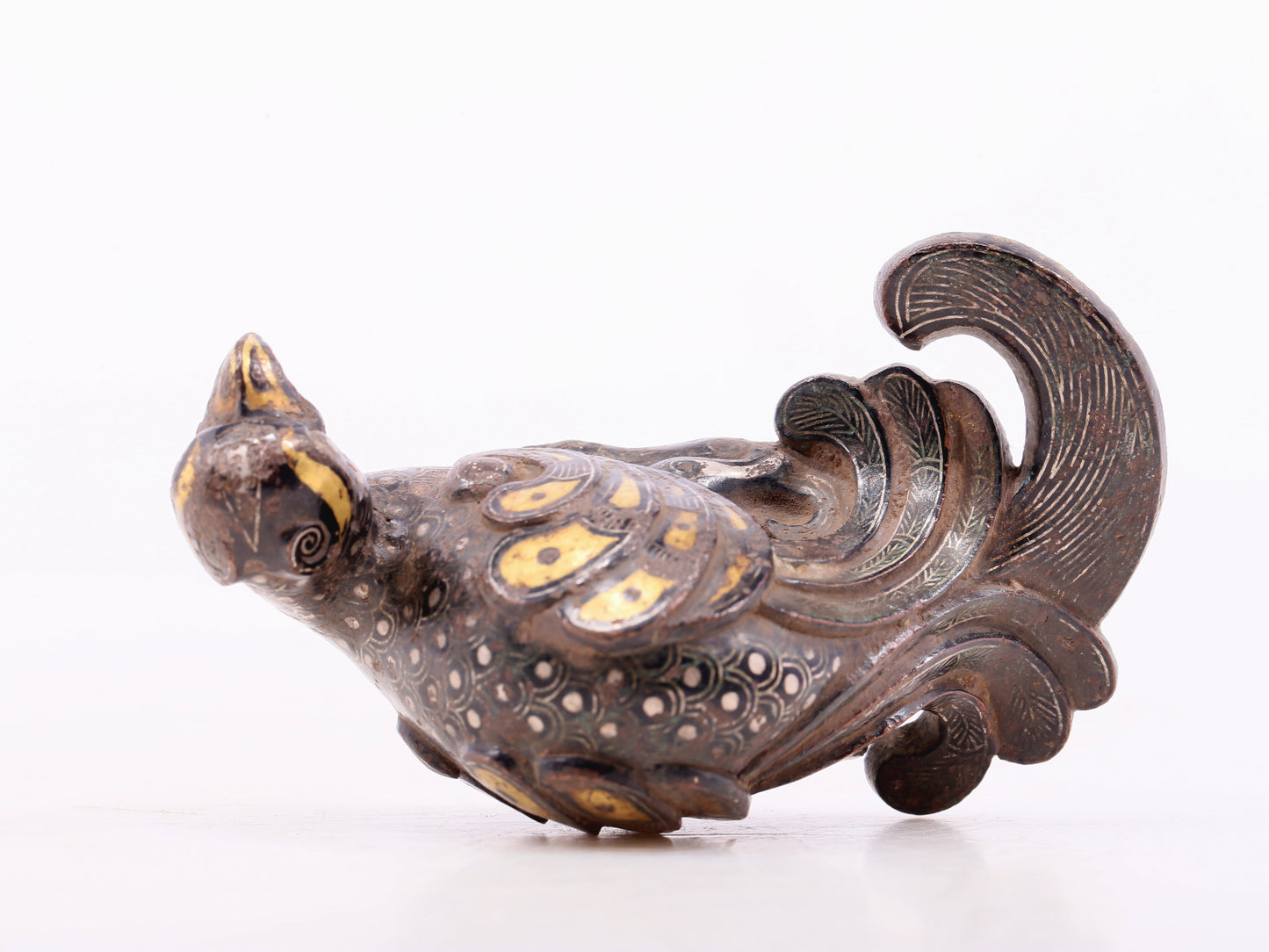 An exquisite bronze inlaid gold and silver bird ornament