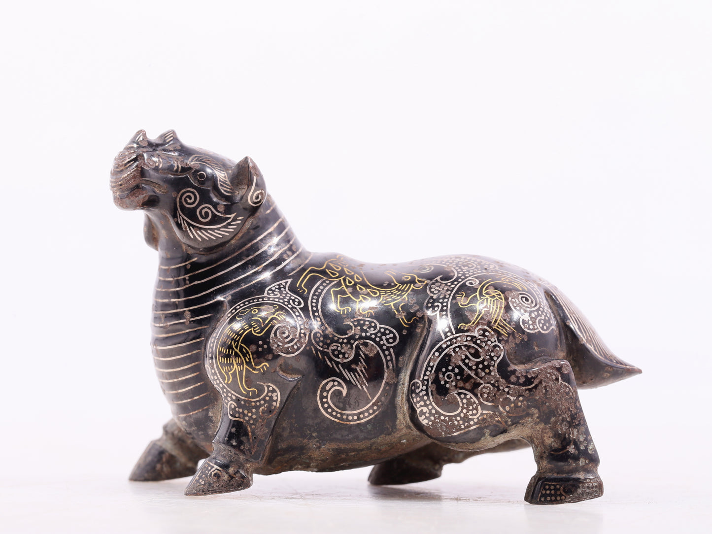 An exquisite bronze inlaid gold and silver auspicious animal ornament