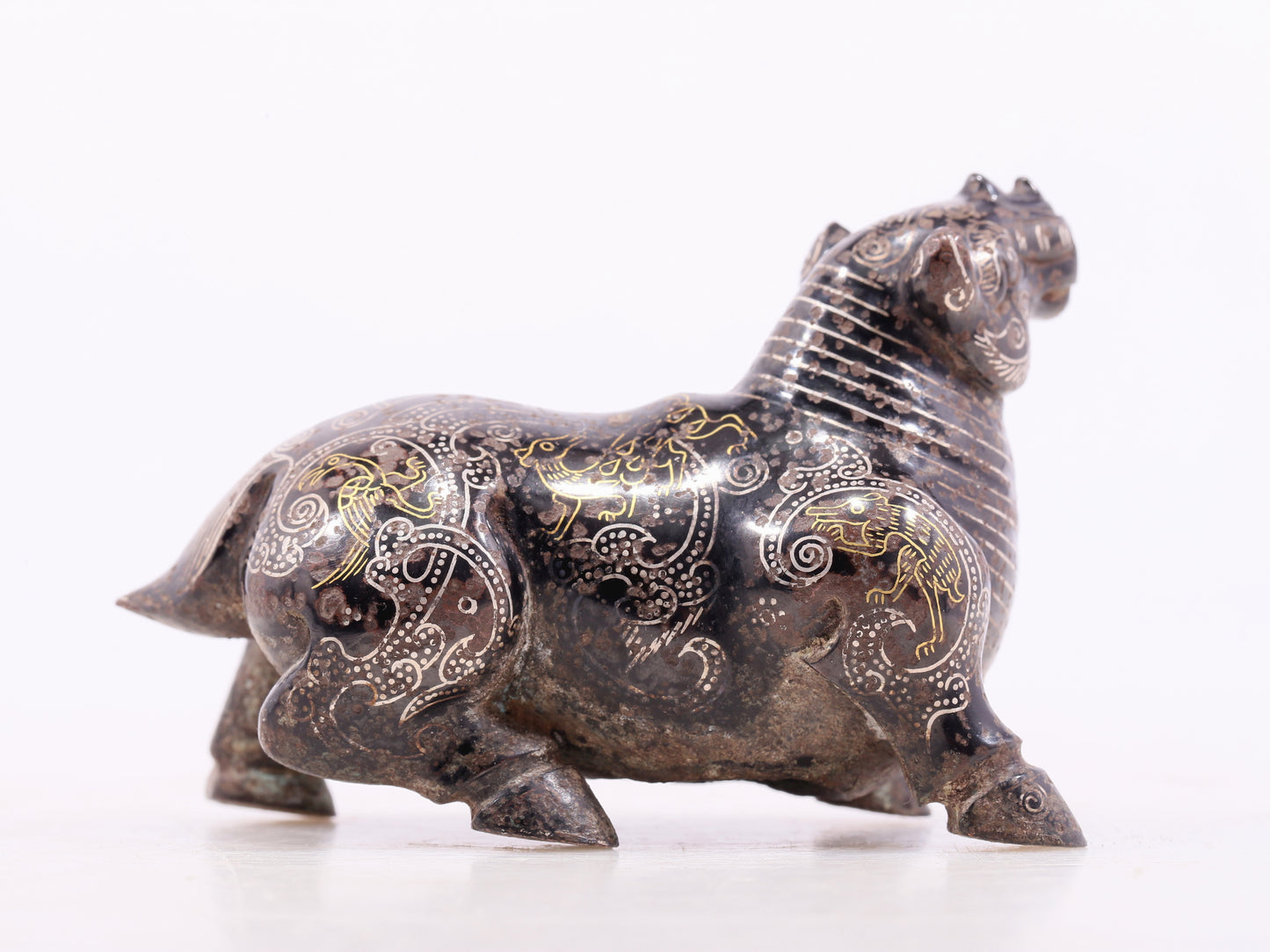 An exquisite bronze inlaid gold and silver auspicious animal ornament