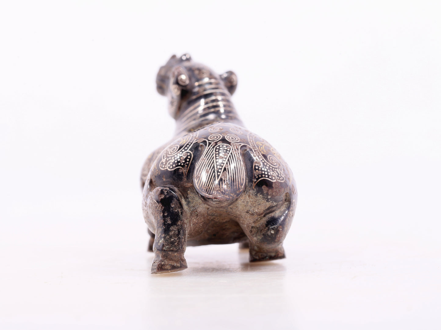 An exquisite bronze inlaid gold and silver auspicious animal ornament