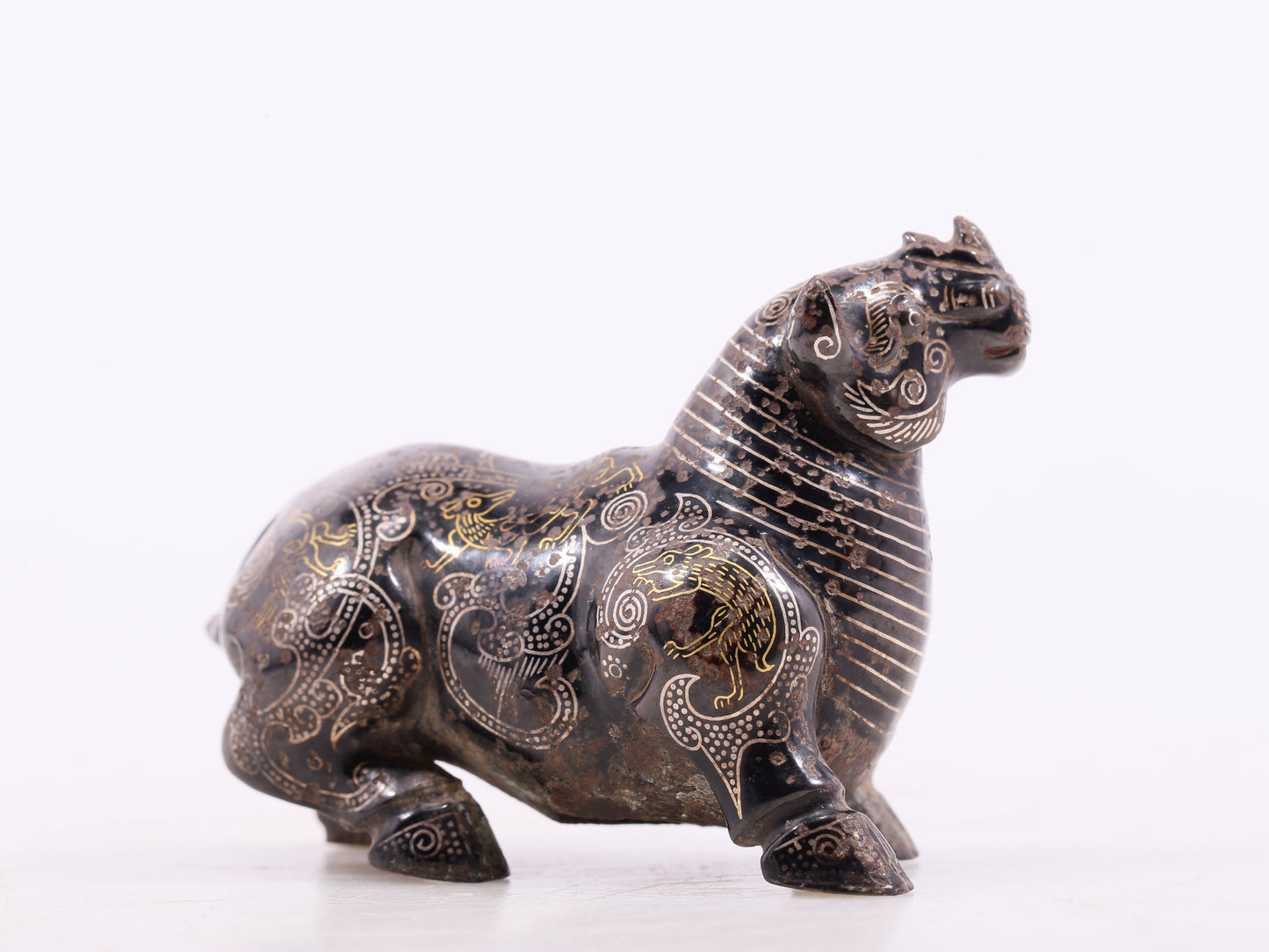 An exquisite bronze inlaid gold and silver auspicious animal ornament