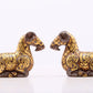 A pair of bronze inlaid gold and silver goat ornaments