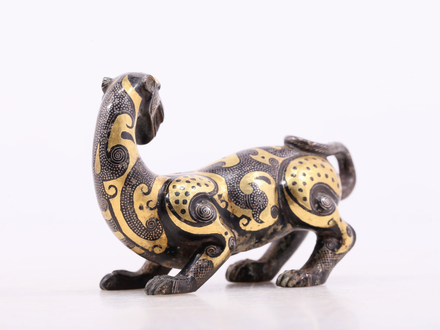 An exquisite bronze inlaid gold and silver leopard ornament