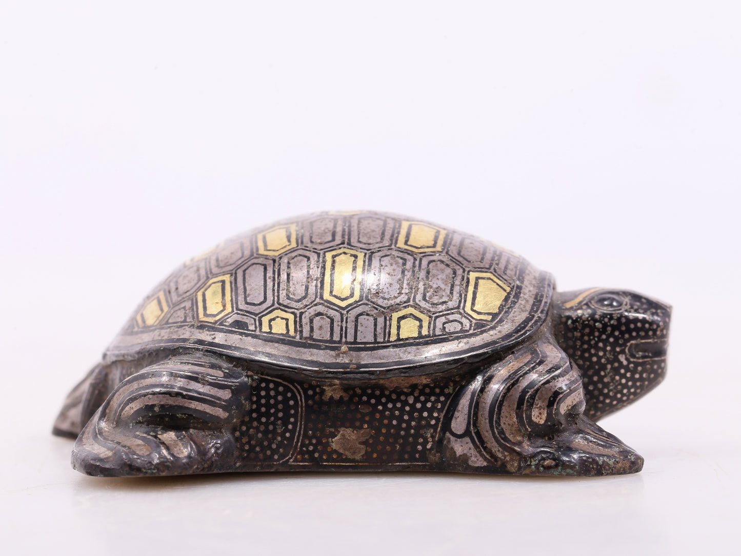 An exquisite bronze inlaid gold and silver turtle ornament