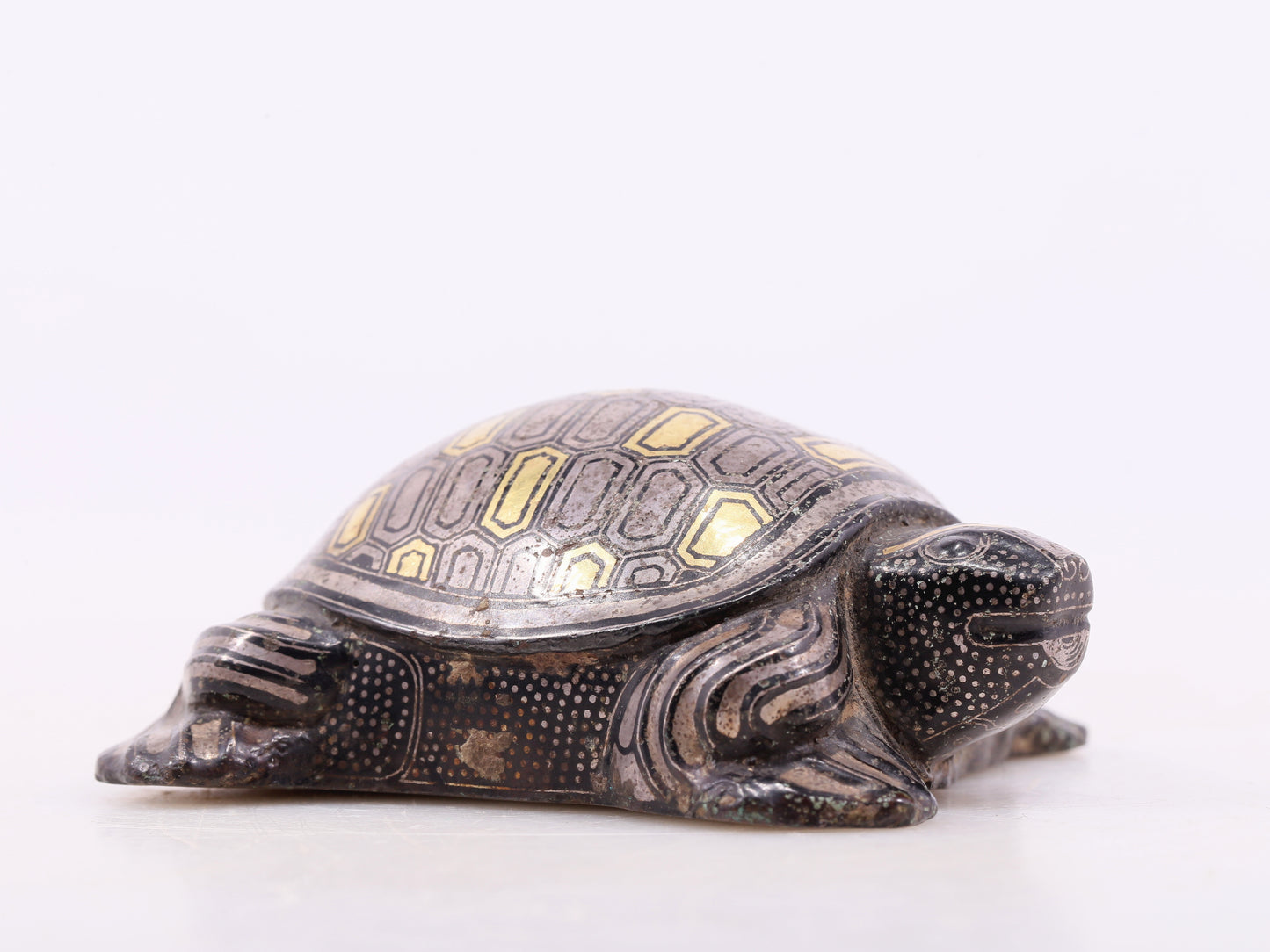 An exquisite bronze inlaid gold and silver turtle ornament