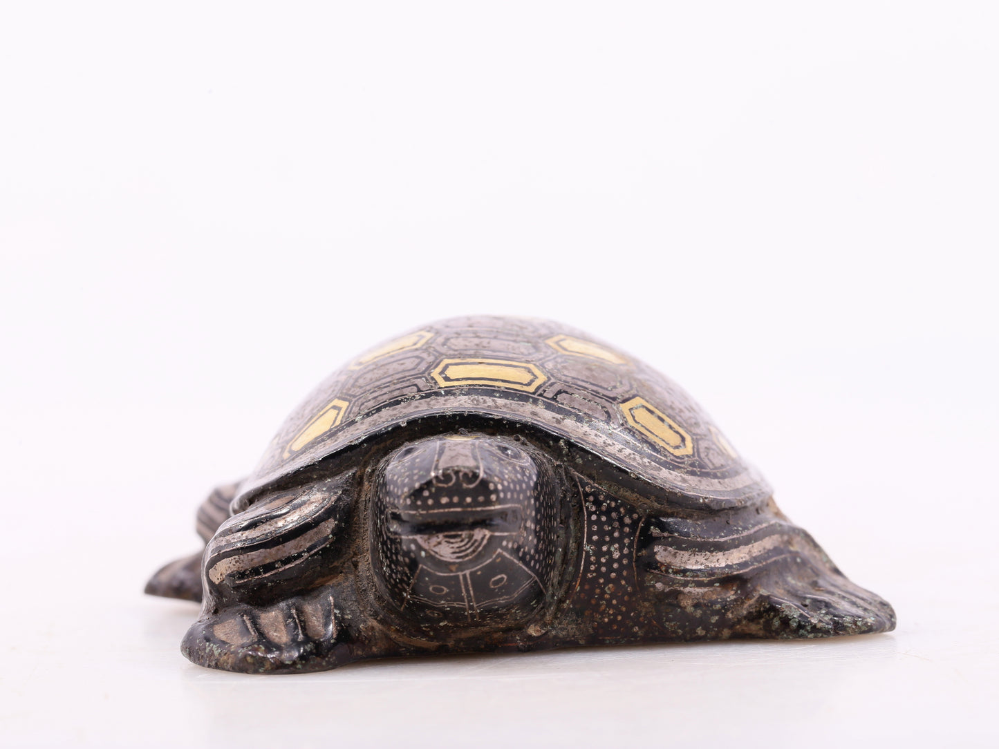 An exquisite bronze inlaid gold and silver turtle ornament