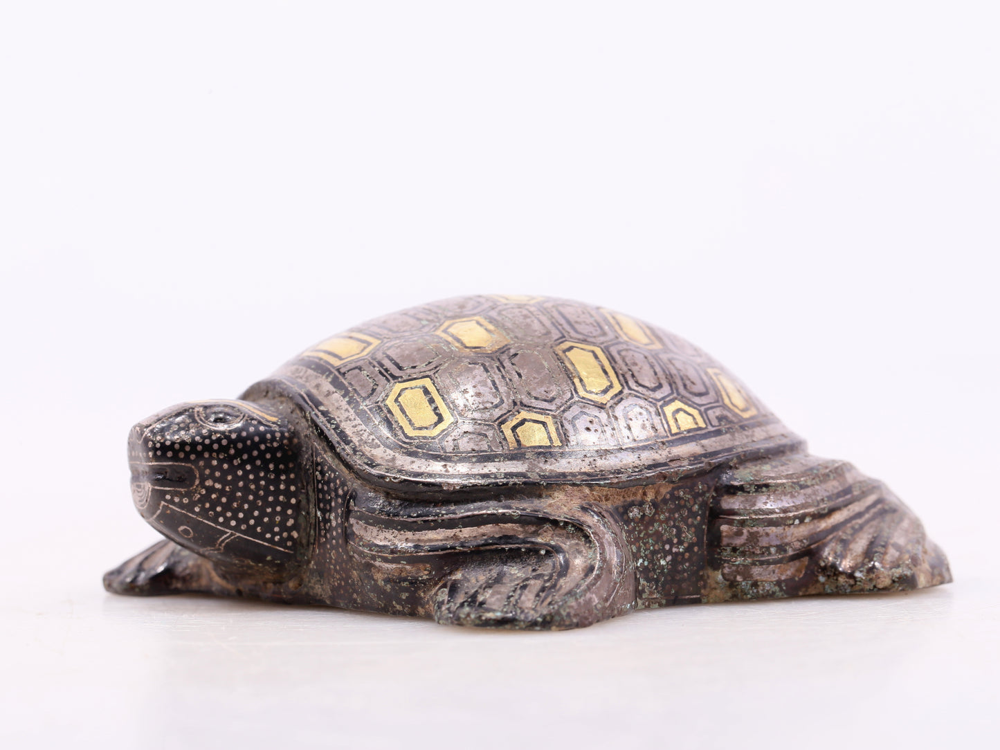 An exquisite bronze inlaid gold and silver turtle ornament