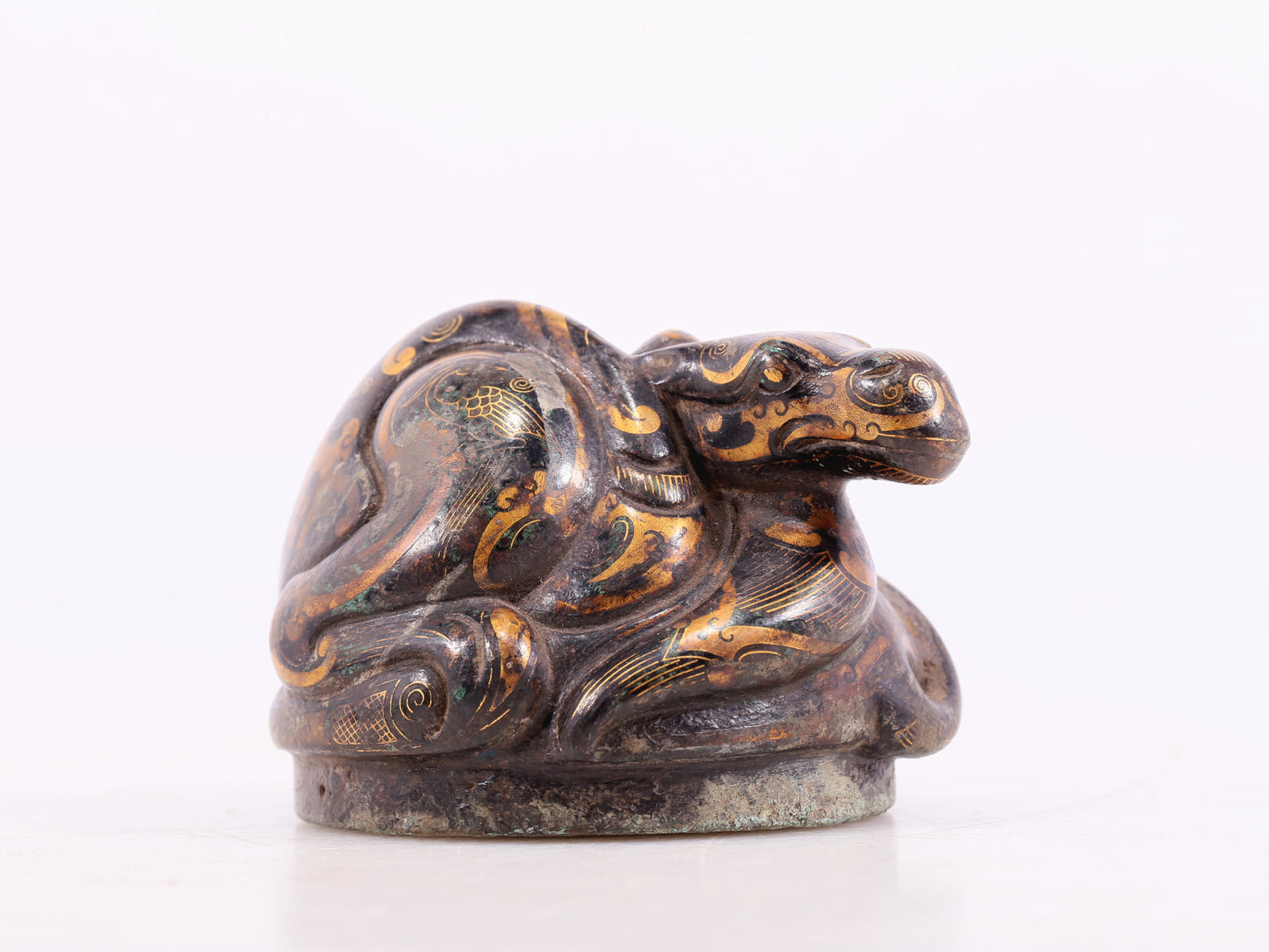 An exquisite bronze-inlaid auspicious animal ornament